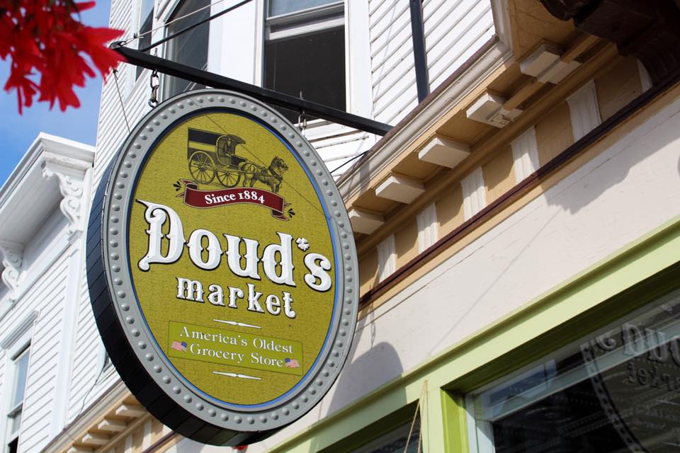 A Doud's Market sign hangs outside America's oldest grocery store on Mackinac Island's Main Street
