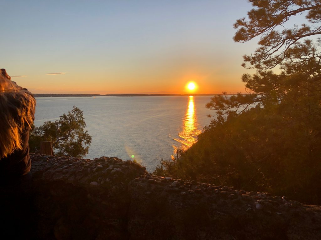 View of Sunset over the water from Mackinac Island's Sunset Rock near the Inn at Stonecliffe