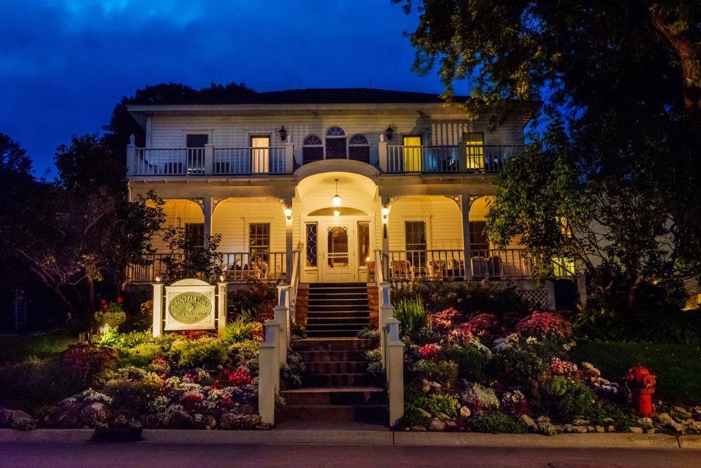 The front of the Cloghaun B&B on Mackinac Island is lit up at night