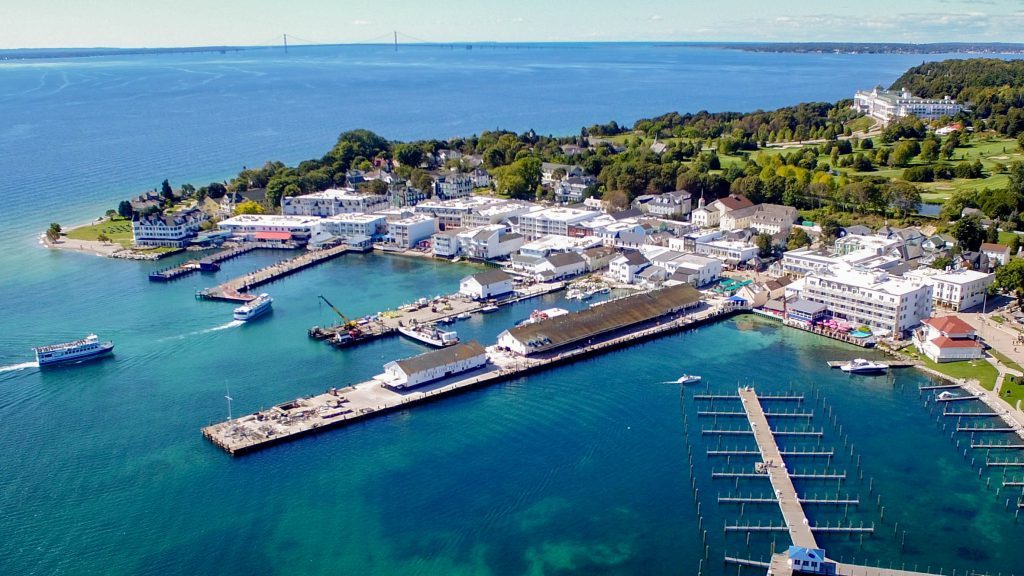 A drone view of downtown Mackinac Island and the boats in the harbor