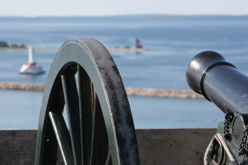 A cannon at Mackinac Island's historic Fort Mackinac points over the water