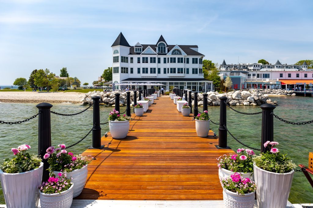 A dock leads out into the water from the historic Hotel Iroquois in downtown Mackinac Island