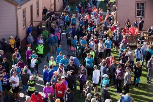 A crowd of runners gathers for the Fort2Fort 5 Mile run on Mackinac Island in the spring