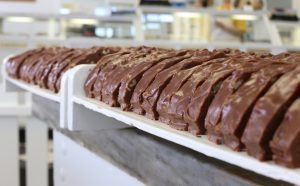Slices of world-famous Mackinac Island fudge are lined up inside one of Mackinac Island’s many fudge shops.