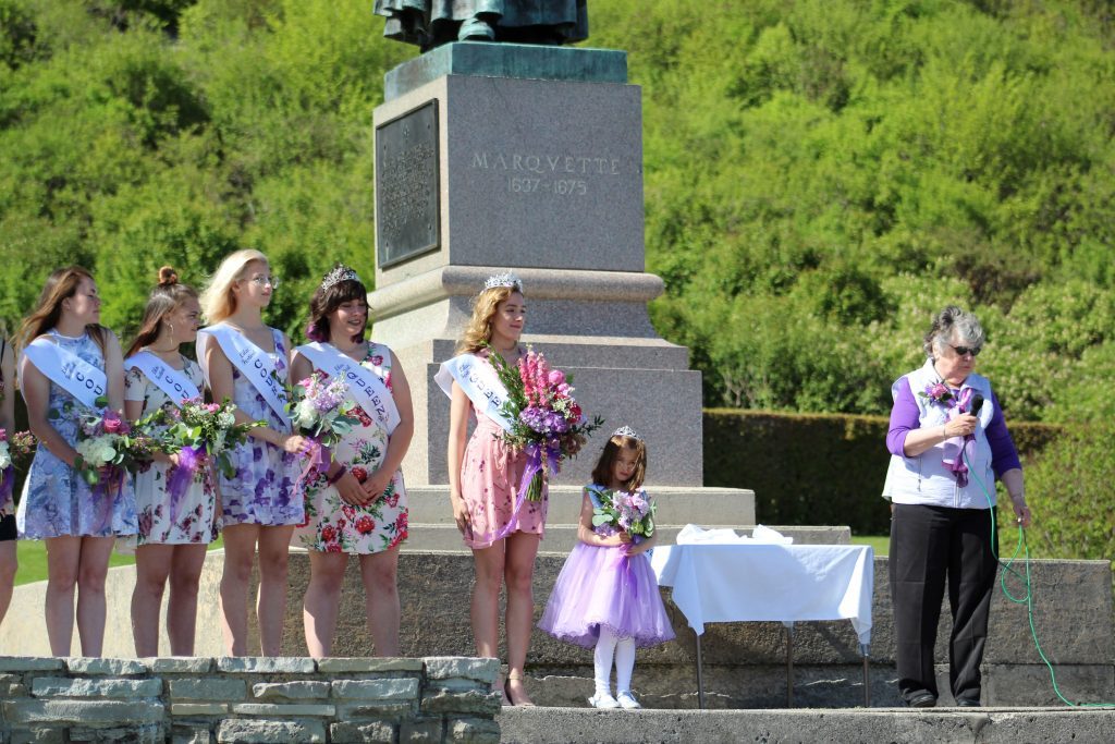 The Mackinac Island Lilac Festival queen and her court are introduced by Mayor Margaret Doud in Marquette Park