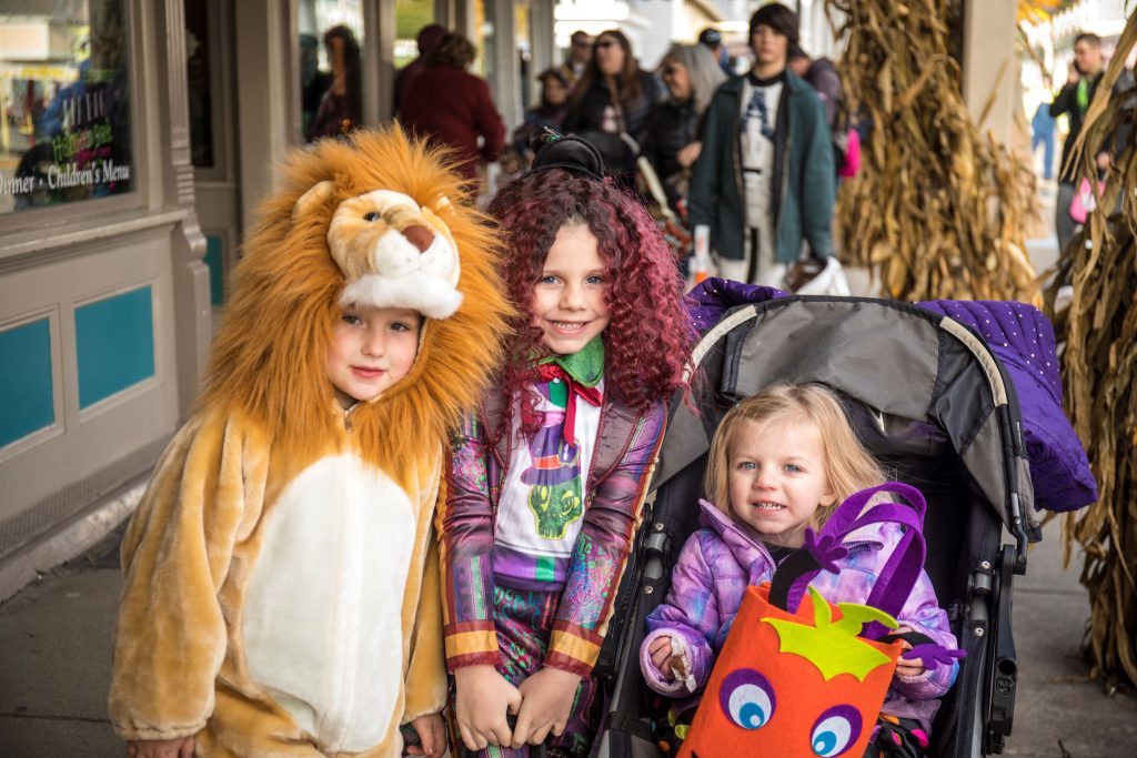 Children dressed in Halloween costumes go trick-or-treating on Mackinac Island