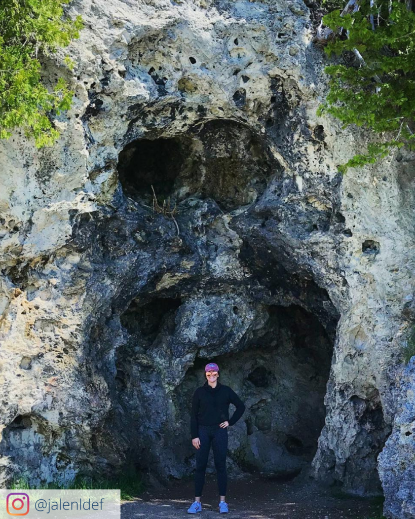 A woman poses for a picture inside Devil’s Kitchen on a run around Mackinac Island. 