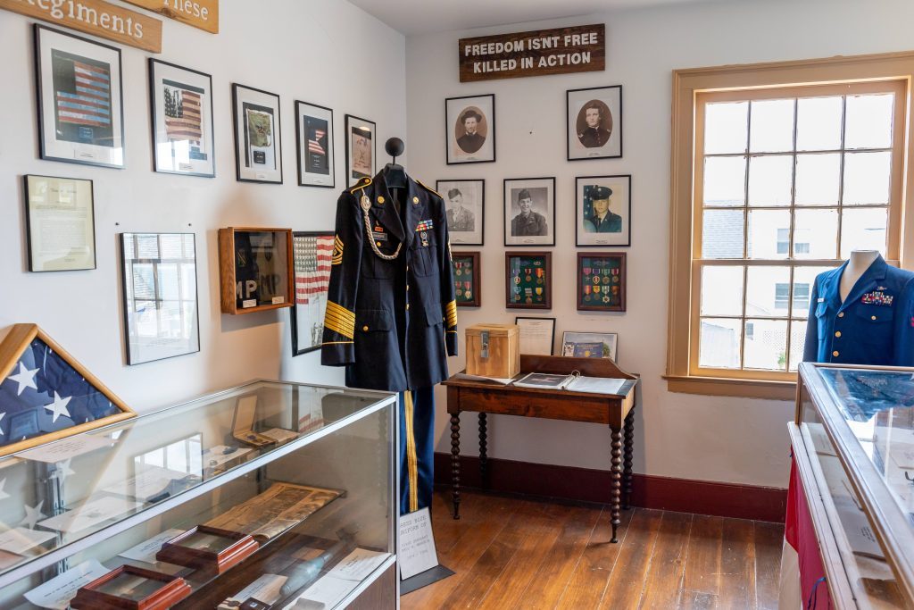 A military uniform and other artifacts from Mackinac Island's history as a U.S. Army fort are on display inside the Stuart House City Museum