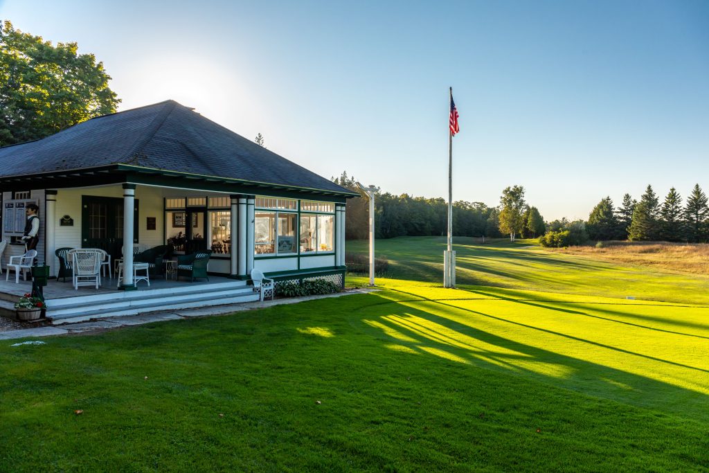 An American flag flies above the clubhouse at Mackinac Island’s Wawashkamo Golf Club.