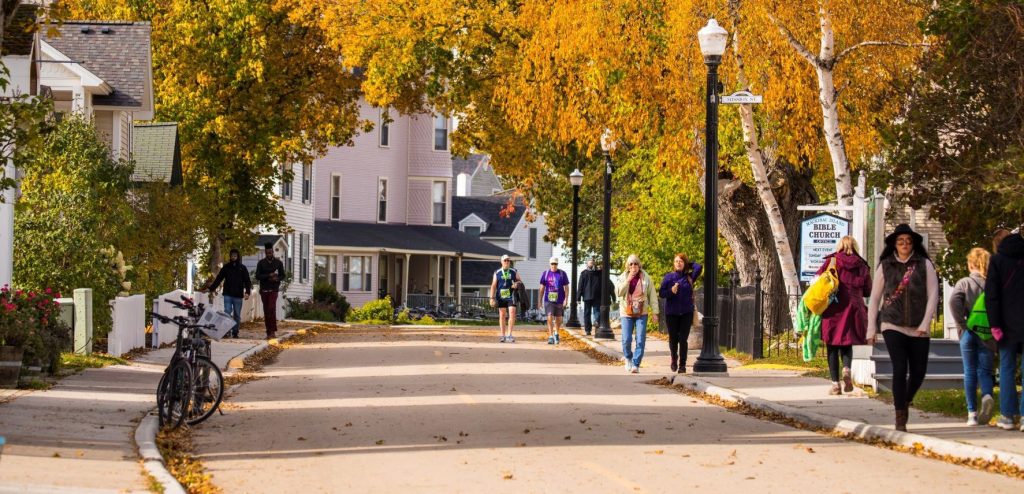 Mackinac Island features beautiful fall colors, leaves on the streets and fun annual events including Halloween Weekend.