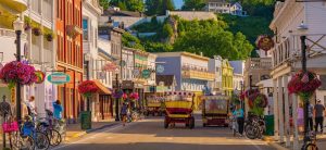 Horse-drawn taxis fill Main Street on a sunny summer day in downtown Mackinac Island