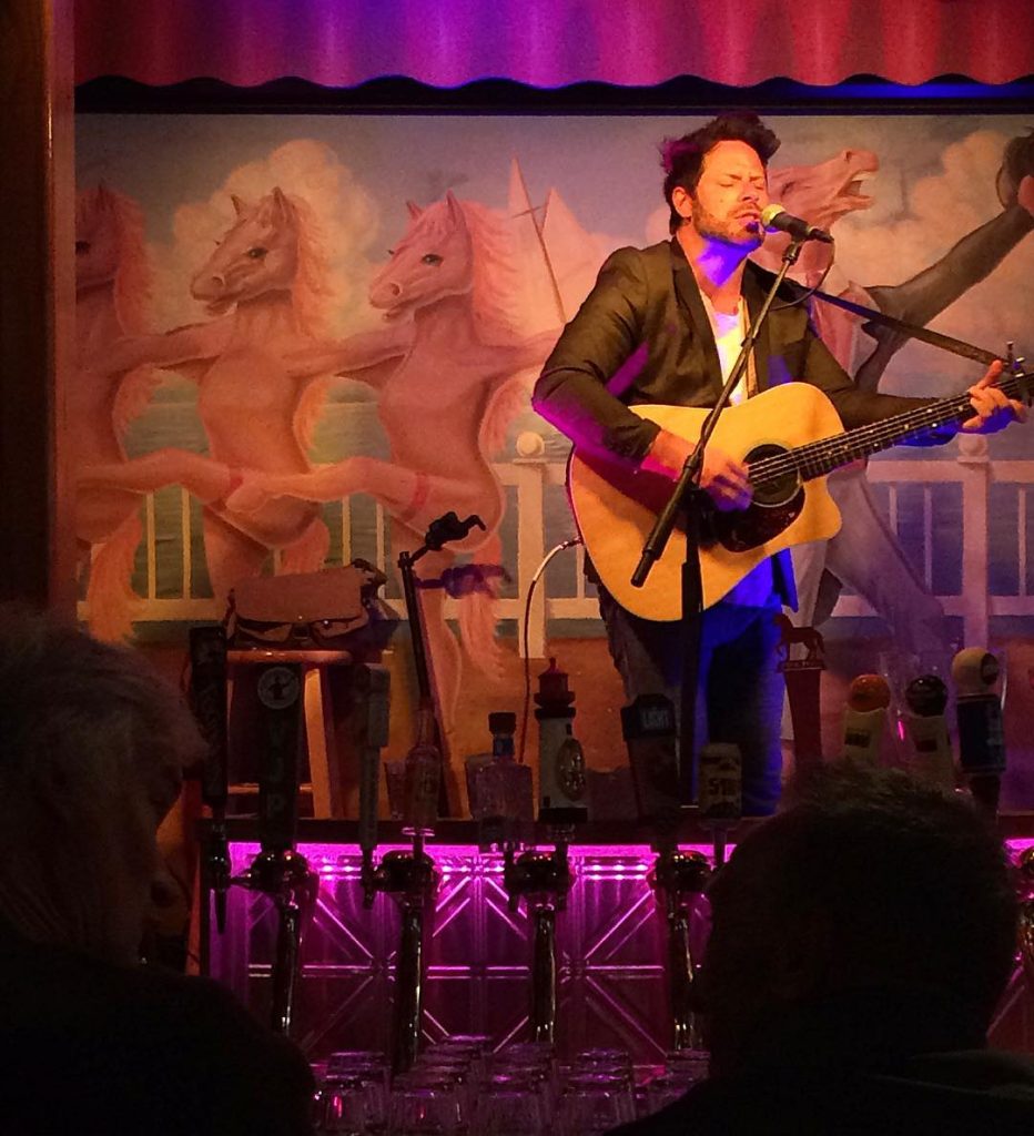 A guitarist plays and sings in the Pink Pony bar and restaurant in downtown Mackinac Island