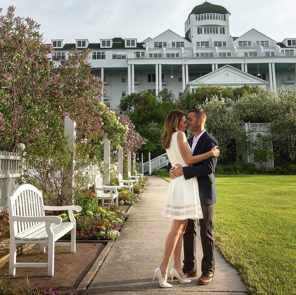 Couple Embracing for Photo in Front of Grand Hotel on Mackinac Island
