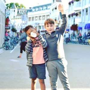 Two young boys stand in the middle of Main Street in downtown Mackinac Island