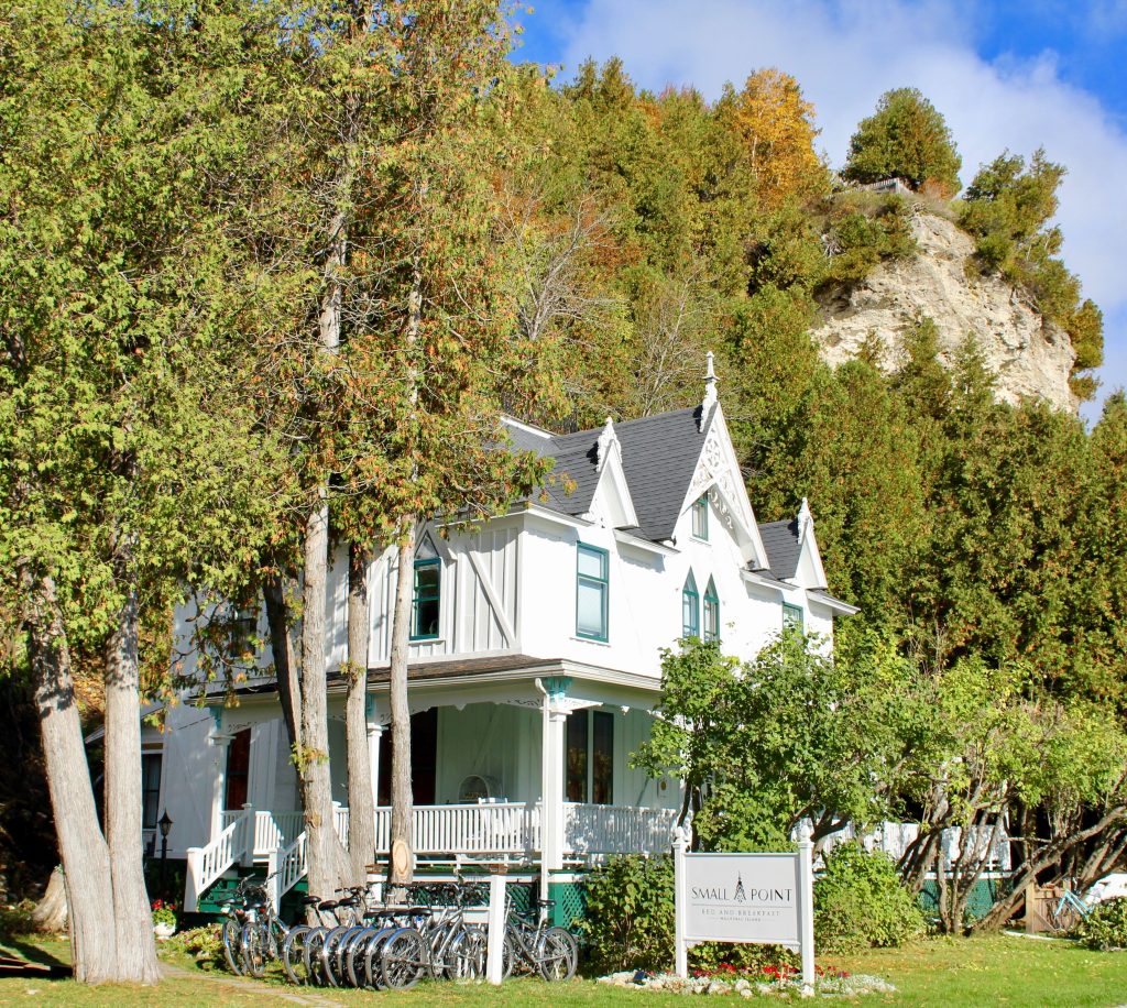 Mackinac Island’s Small Point B&B stands beneath the Robinson’s Folly overlook on a gorgeous fall day with leaves turning color
