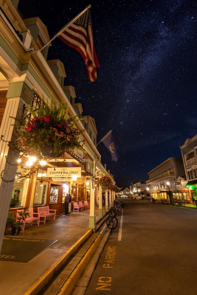 Stars sparkle above Mackinac Island's Main Street at night when the roads are quiet and lined with bicycles