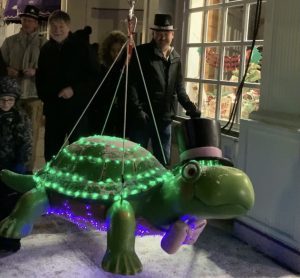 New Year's revelers admire a lighted turtle during Mackinac Island's New Year's Eve Great Turtle Drop
